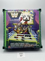 Front view of MOTU WWE Grayskull Ring box with colorful illustration of wrestling characters in a ring.