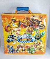 Front of the large rectangular storage case featuring Skylanders Giants characters on an orange background with the Skylanders Giants logo.