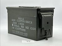 Side angled view of metal military ammunition storage can showing white stencil markings indicating 400 cartridges, .303 inch, ball MK 8Z CDN in cartons.