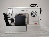 Pfaff 1222E sewing machine side view with foot control and power cord attached