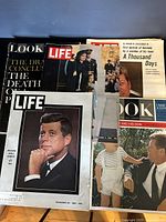 Photo showing stack of vintage Life and Look magazines featuring JFK and his assassination, plus LBJ and RFK covers.