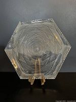 Front view of hexagon shaped crystal glass platter with detailed geometric etching patterns