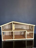 Full view of the open two-story vintage Lundby dollhouse showing empty rooms and structural details.