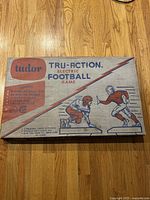 Original box for Tudor Tru-Action electric football game showing graphics and vintage branding