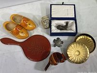 Overview photo of the tabletop grouping showing all seven items on a white surface.