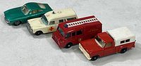 All four vintage Matchbox toy vehicles aligned side by side showing colors and details