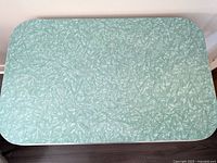 Top-down view of pale green cracked ice Arborite laminate tabletop