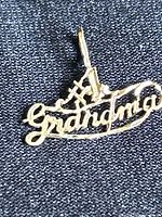 Close-up front view of the 14 karat gold #1 Grandma pendant showing the scripted text with three stars on the number 1.
