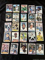Photo of 20 vintage baseball cards with visible players, teams, and logos. Cards vary in color and design, showing players in portrait and action shots.