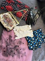 Photo of the three scarves, lambskin gloves, crocheted gloves, and embroidered purse