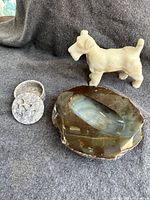 Overview of all three items including natural stone centerpiece, white stone dog statue, and fish-shaped jewelry box.