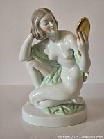 Front view of Herend porcelain figurine