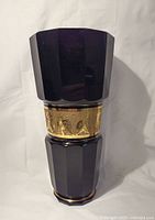 Front view of the vase showing polygonal shape and deep amethyst color