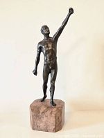 Full front view of bronze figure and marble base