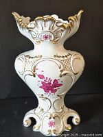 Full front view of vase showing shape and pink floral decor