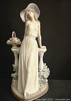 Front view of the full figurine on a black background