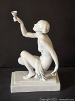 Three-quarter frontal view of the porcelain figure on black background