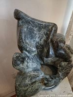 Front-left view showing overall form and open circular space