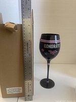 Goblet beside ruler and box showing height and packaging
