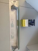 Front view of towel rail packaging and Scosche phone mount box