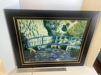 Front view of framed artwork including bridge scene