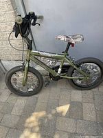 Full left side view of bicycle showing frame color, tires and overall condition