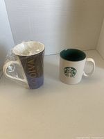 Front view of both mugs showing brands