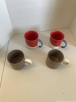Overview of four Starbucks mugs showing colors and handles