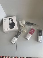 Front view showing WH-CH400 box and five earbud packs