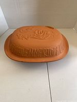 Oblong terracotta lid with rooster motif and Schlemmertopf lettering