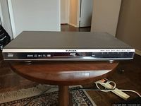 Daenyx DVD player P80L unit on a wooden table