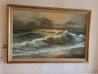 Full view of framed seascape painting hung on wall