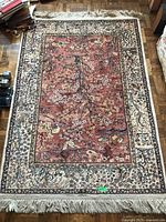 Full view of rectangular rug laid on parquet floor