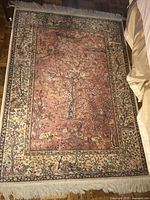 Overhead view of entire rug showing full pattern and fringe