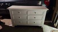 Front view of six-drawer dresser in garage setting