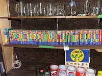 Shelf showing a large set of Archie Comics books arranged side by side with colorful spines featuring series logos and characters.