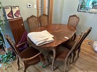 Full set view showing oval table, six chairs and accessories