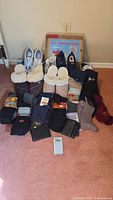 Photo shows the entire lot including shoes, slippers, socks, and wallets