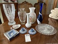 Overall view of the lot showing all vases, Wedgwood candle holders, Aynsley dish and crystal dishes