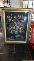 Full view of framed floral still life painting showing entire artwork and frame.