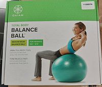 Front of box showing Gaiam Total Body Balance Ball kit with size and target user height info