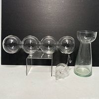 Photo showing all items: four-sphere clear glass propagator, mouse-shaped propagator, and bulb starter vase.