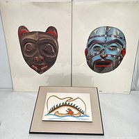 Two Haida mask art prints and one framed Sioux art print displayed together on a white surface.