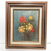 Framed floral still life oil painting on canvas showing the full artwork and frame.