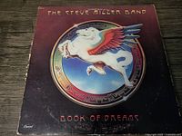 Front cover of the vinyl album showing the Pegasus emblem and album title with slight wear on the edges.