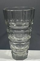 Front view of entire vase showing stacked geometric tiers