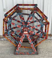 Front view of painted wooden Ferris wheel structure