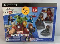 Box of Disney Infinity 2.0 Edition Starter Pack for PS3 showing cover art with Marvel superheroes and included figures.