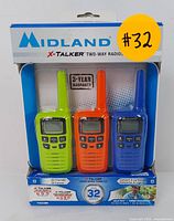 Front of retail box showing all three radios in green, orange, and blue, with branding and range info visible.