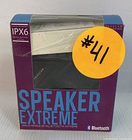 Photo of Proscan Speaker Extreme in original packaging showing the product name, IPX6 water resistance rating, and Bluetooth compatibility.